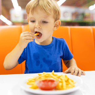 Boy Eating Fries at FEC